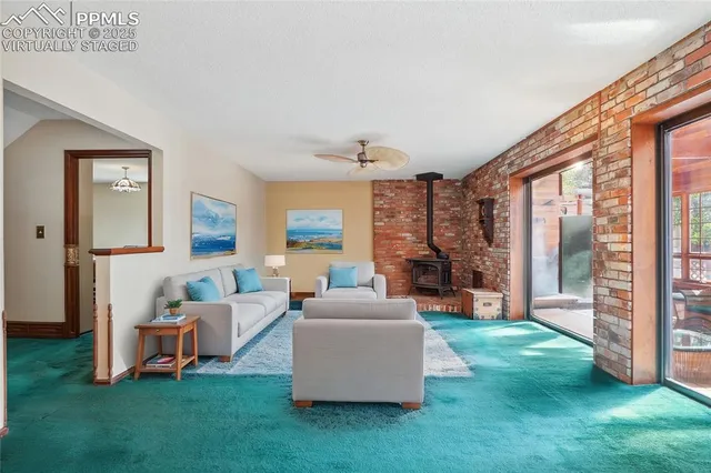 a living room with furniture and a gate