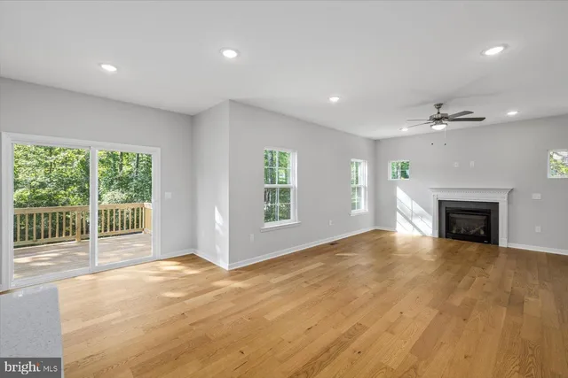 a view of balcony with wooden floor and fence