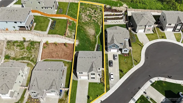 an aerial view of a house with outdoor space sitting space