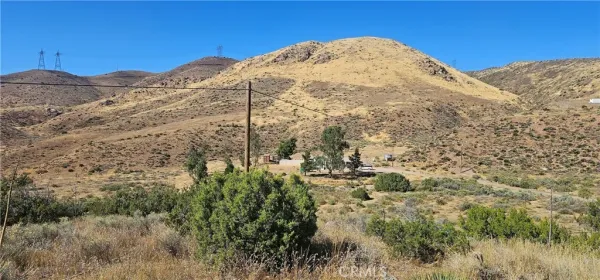 a view of a mountain view with mountains in the background