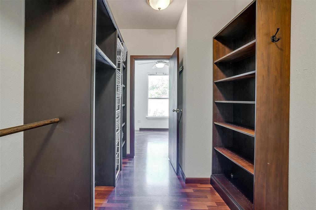 708 South Waco Street Weatherford, TX 76086 - Photo 12 of 35 a view of a hallway with wooden floor and closet
