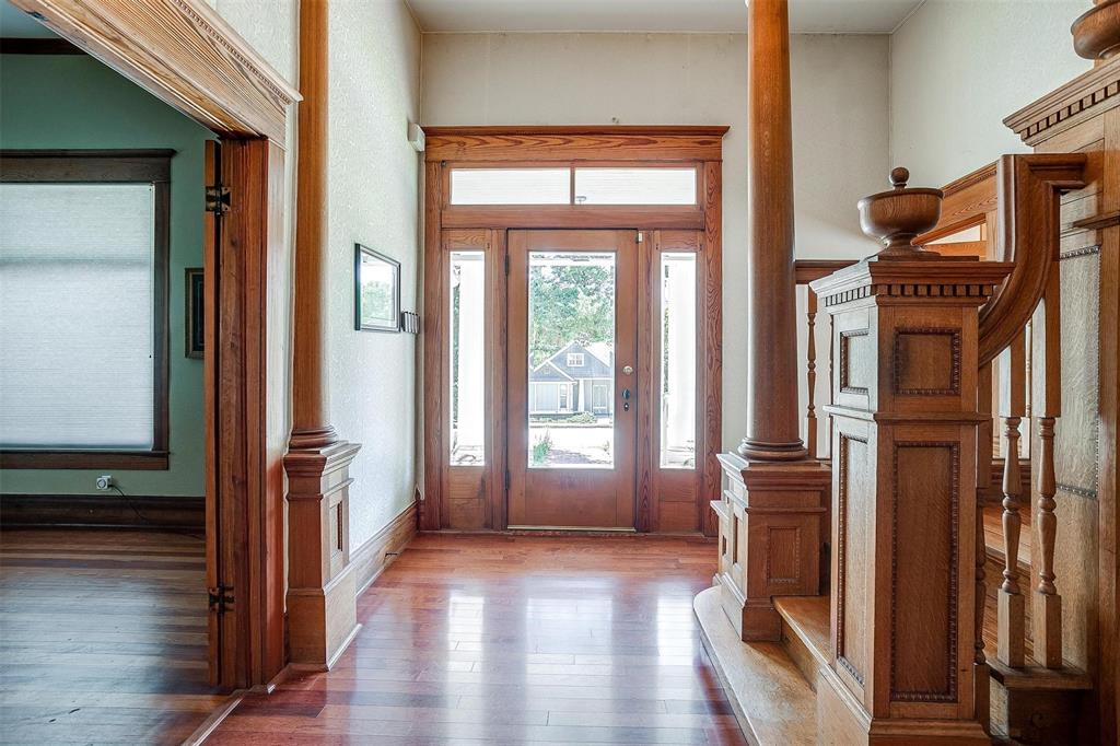708 South Waco Street Weatherford, TX 76086 - Photo 3 of 35 a view of hallway with wooden floor and stairs