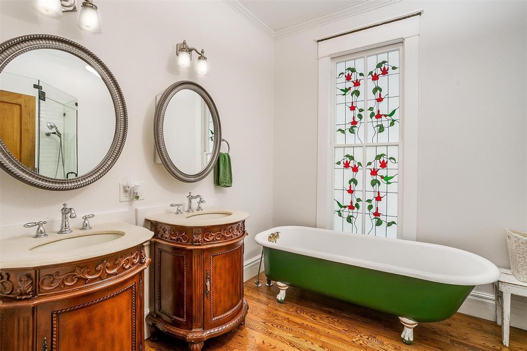 708 South Waco Street Weatherford, TX 76086 - Photo 8 of 35 a bathroom with a sink mirror and vanity