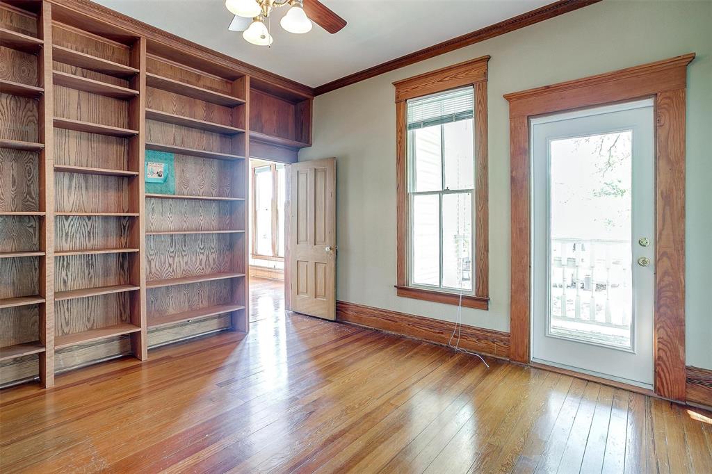 708 South Waco Street Weatherford, TX 76086 - Photo 10 of 35 a view of an empty room with a window and wooden floor