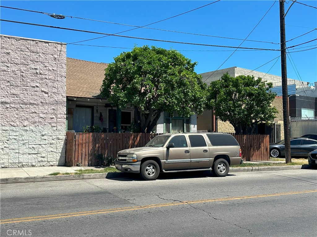 1226 Hooper Avenue Los Angeles, CA 90021 - Photo 2 of 5 a view of a car parked in front of a house