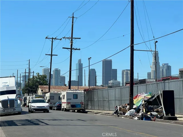 a view of a city street with cars