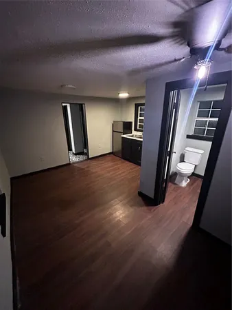 a view of a livingroom with wooden floor