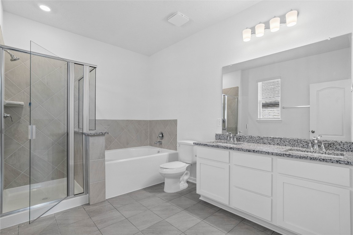 833 Mustang Rdg Terrace Magnolia, TX 77354 - Photo 16 of 21 a bathroom with a toilet sink and shower