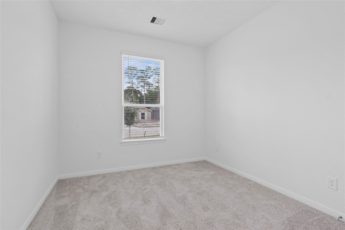 833 Mustang Rdg Terrace Magnolia, TX 77354 - Photo 5 of 21 an empty room with a window