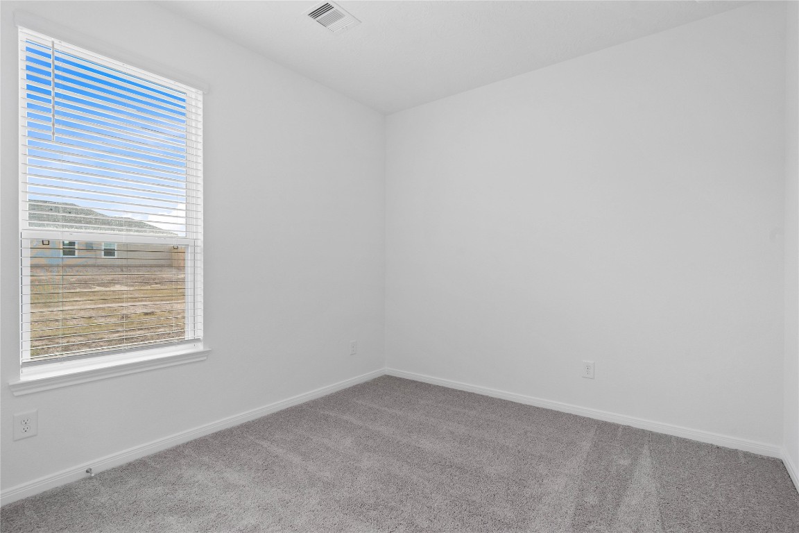 833 Mustang Rdg Terrace Magnolia, TX 77354 - Photo 7 of 21 an empty room with a window
