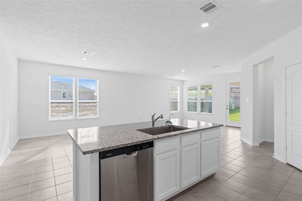 833 Mustang Rdg Terrace Magnolia, TX 77354 - Photo 9 of 21 a kitchen with a sink and large window