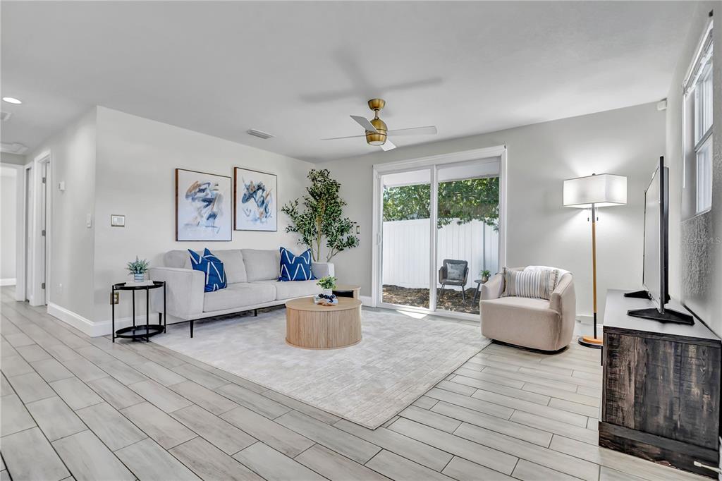 6510 West Chelsea Street Tampa, FL 33634 - Photo 4 of 20 a living room with furniture and a large window