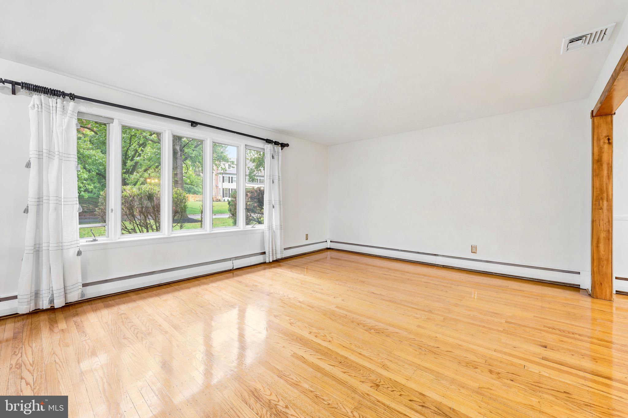 412 Yorkshire Road Bryn Mawr, PA 19010 - Photo 7 of 25 a view of an empty room with a window