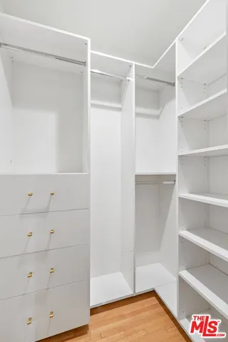 a view of an empty walk in closet