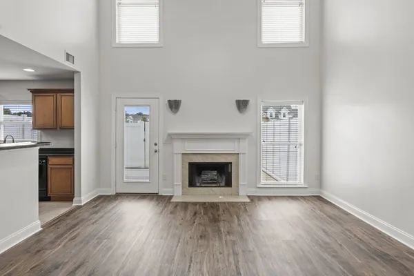 a view of kitchen with furniture and wooden floor