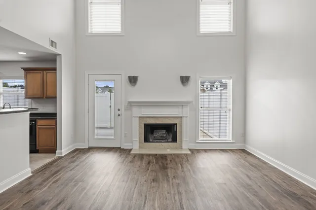 a view of kitchen with furniture and wooden floor
