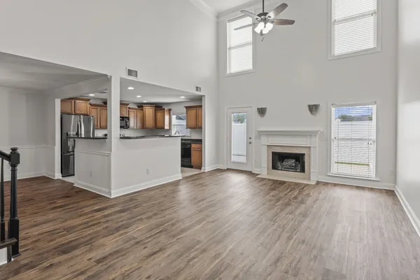 a kitchen with granite countertop white cabinets and sink