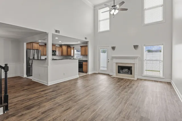 a kitchen with granite countertop white cabinets and sink