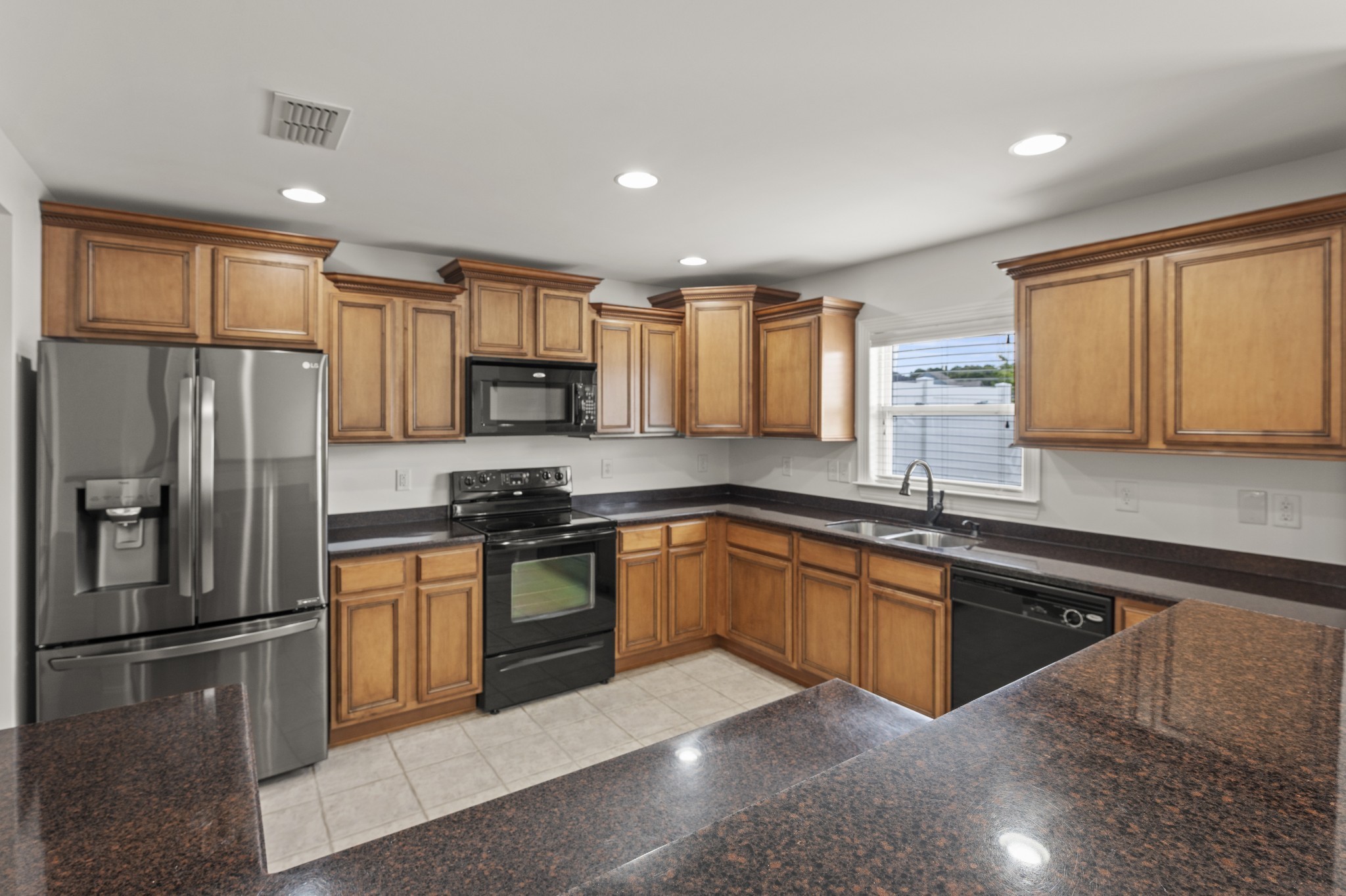 17 ANDERTON Drive Winchester, TN 37398 - Photo 19 of 42 a kitchen with stainless steel appliances granite countertop a refrigerator sink and stove