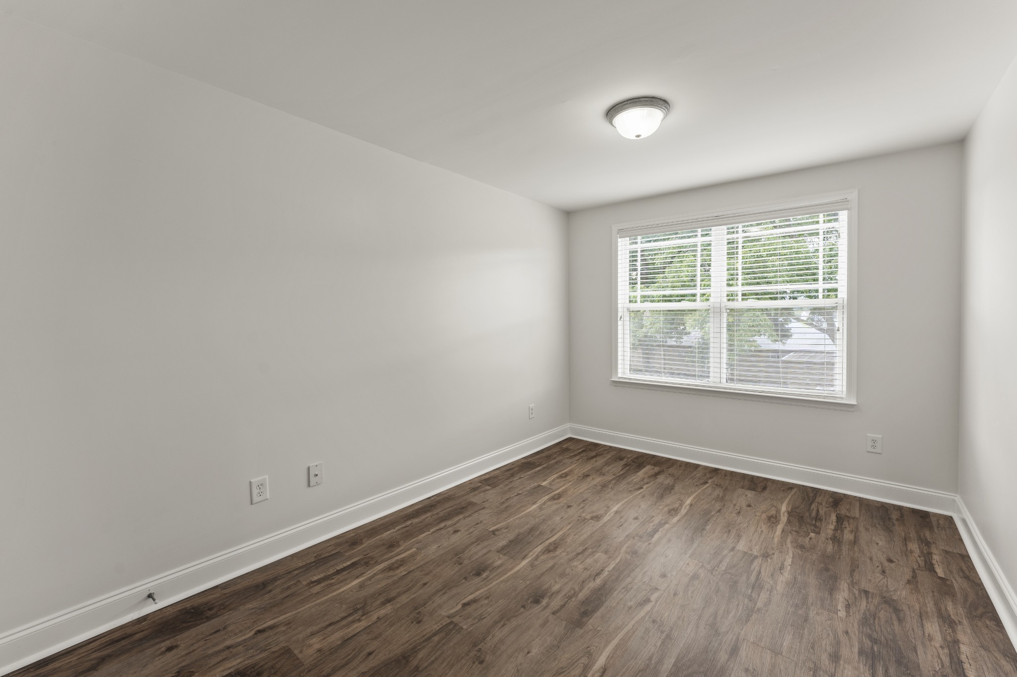 17 ANDERTON Drive Winchester, TN 37398 - Photo 24 of 42 an empty room with wooden floor and windows