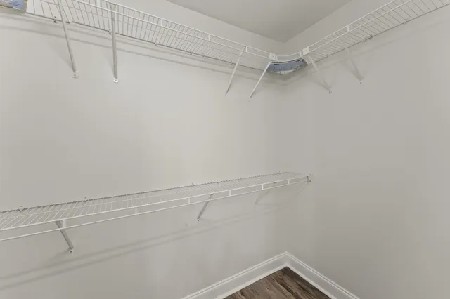 a view of empty room with ceiling fan