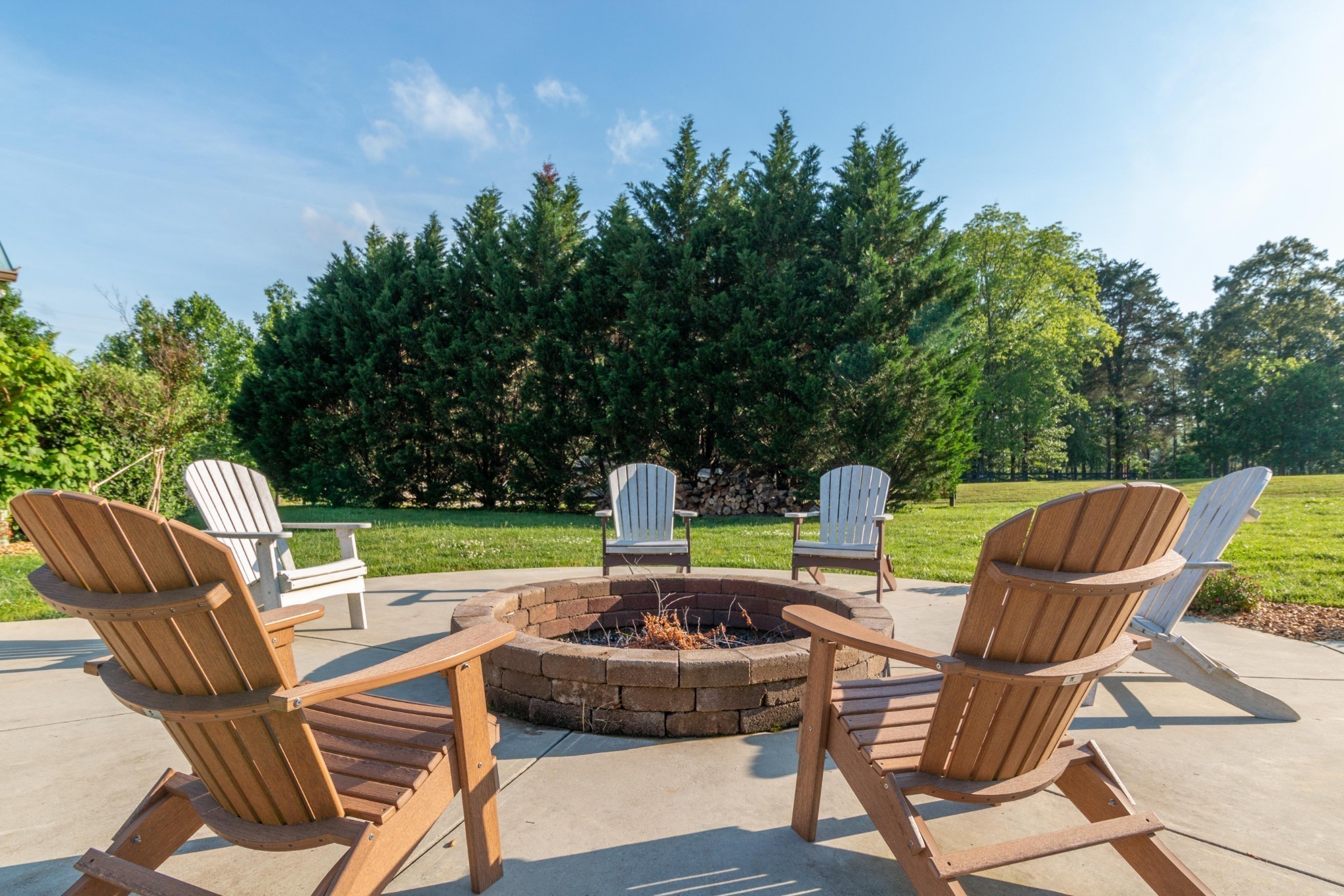 17 ANDERTON Drive Winchester, TN 37398 - Photo 38 of 42 a view of a chair and tables in the back yard of the house