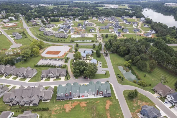 an aerial view of residential houses with outdoor space