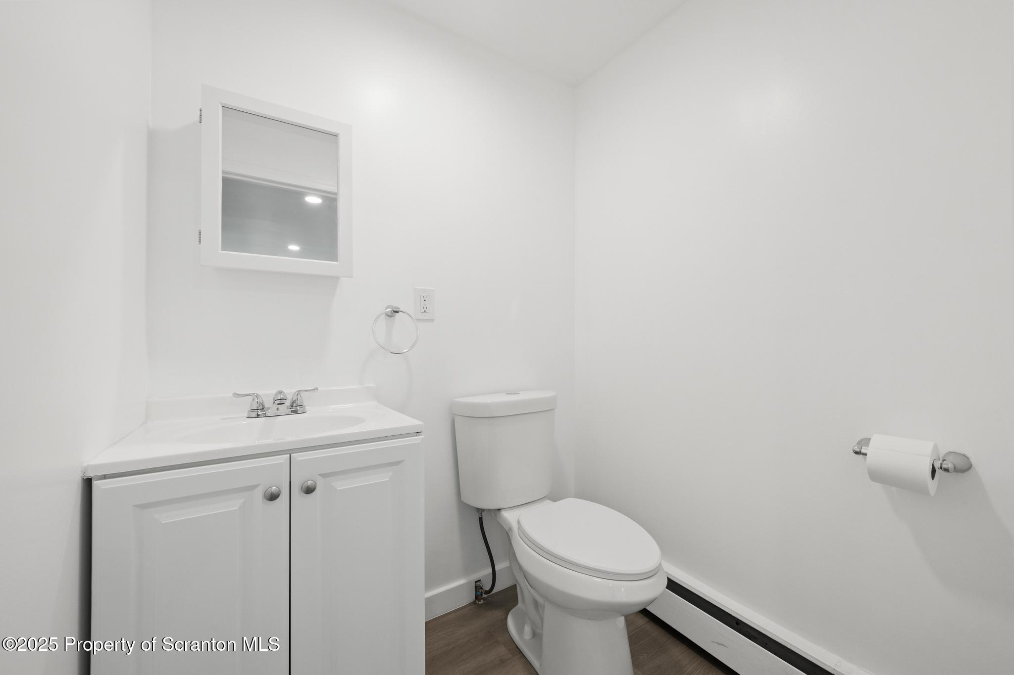 527 St Frances Cabrini Avenue, Unit 2 Scranton, PA 18504 - Photo 13 of 36 a bathroom with a sink a toilet and a mirror