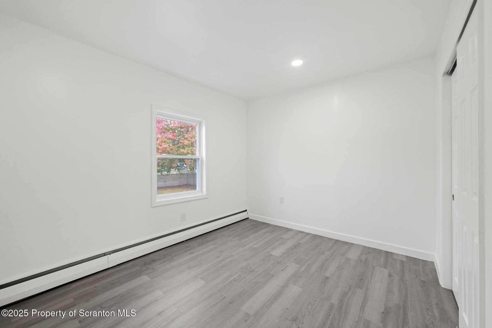 527 St Frances Cabrini Avenue, Unit 2 Scranton, PA 18504 - Photo 15 of 36 an empty room with a window