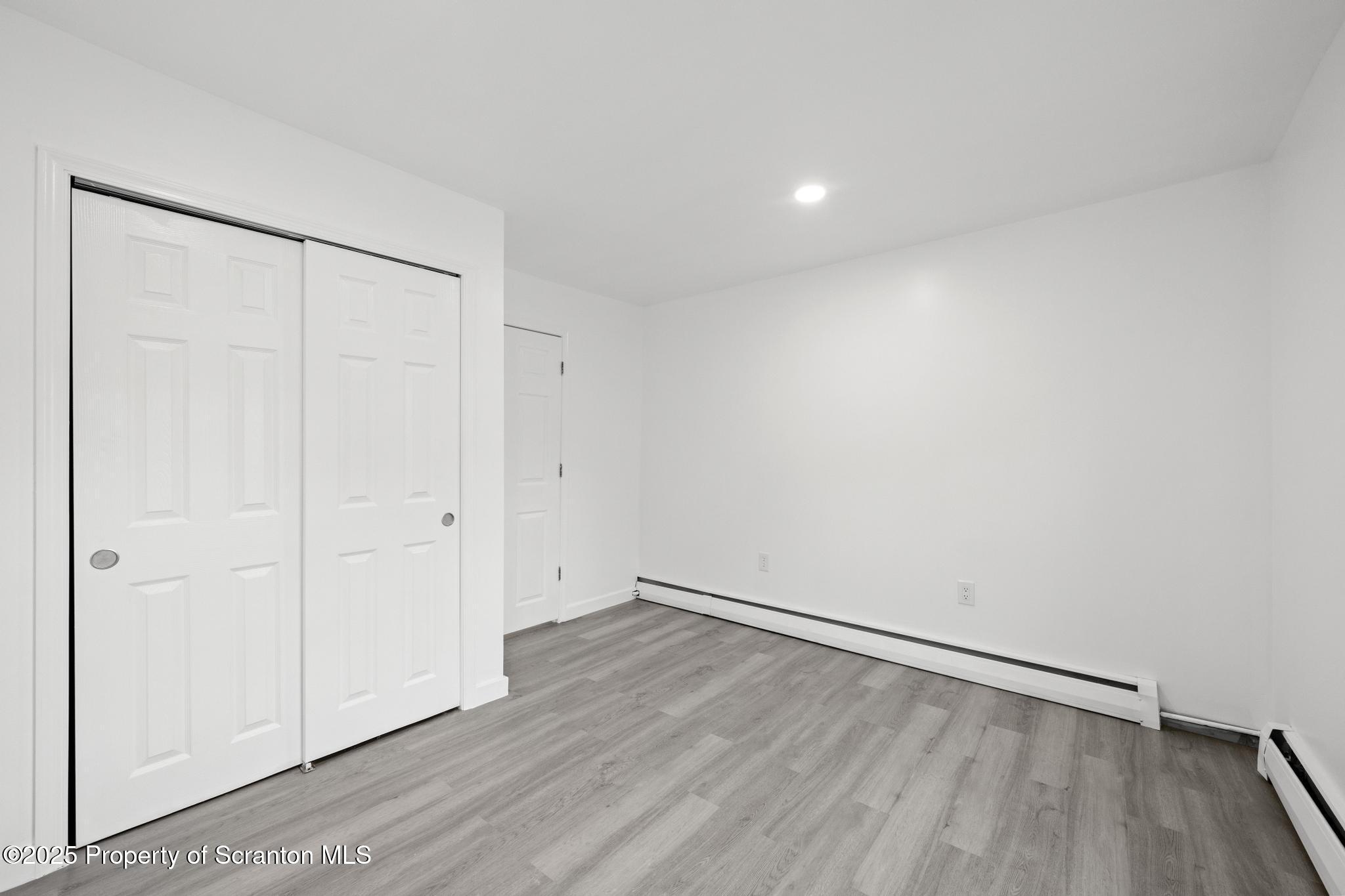 527 St Frances Cabrini Avenue, Unit 2 Scranton, PA 18504 - Photo 17 of 36 a view of an empty room with wooden floor