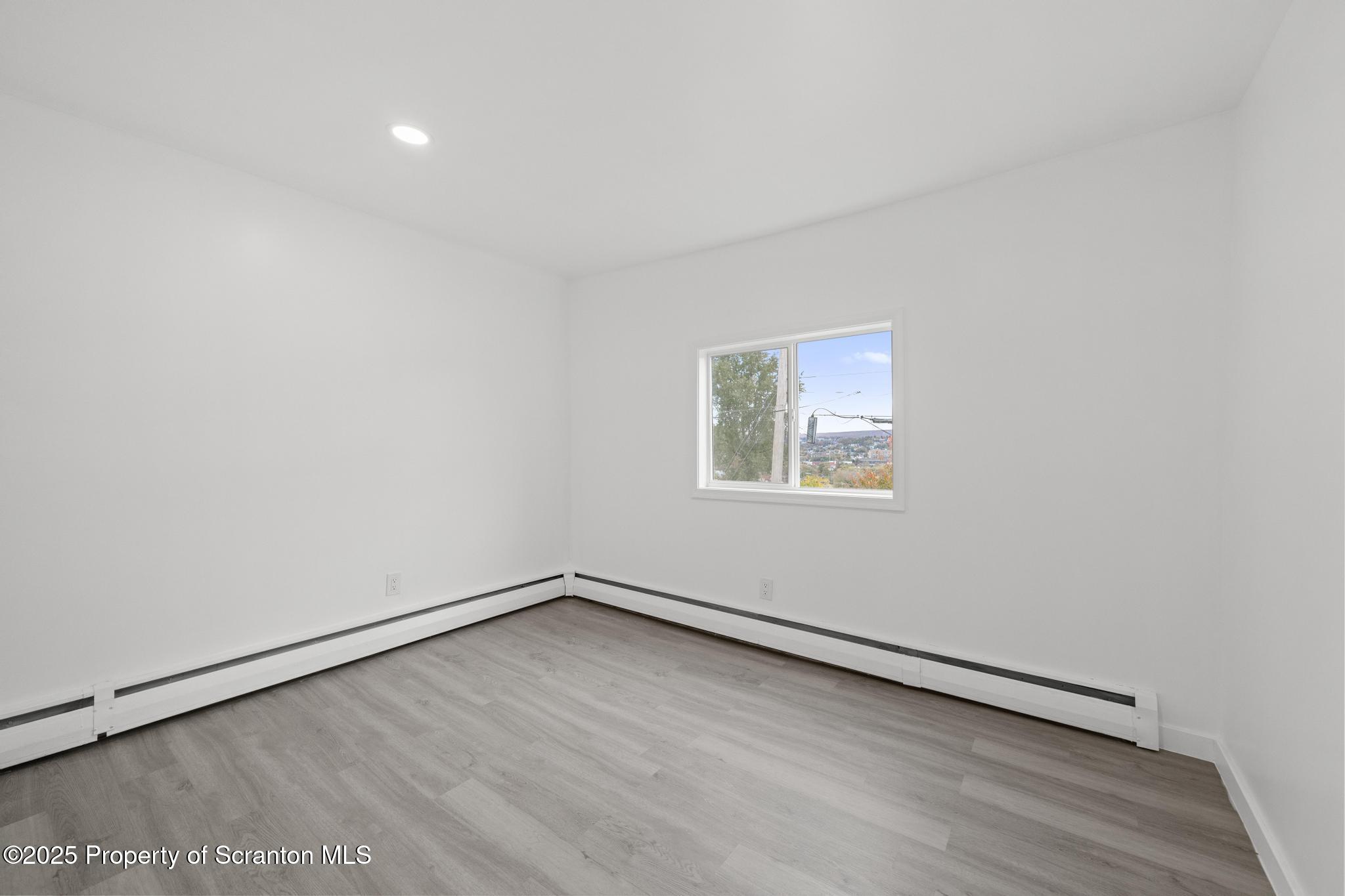 527 St Frances Cabrini Avenue, Unit 2 Scranton, PA 18504 - Photo 20 of 36 an empty room with a workbench