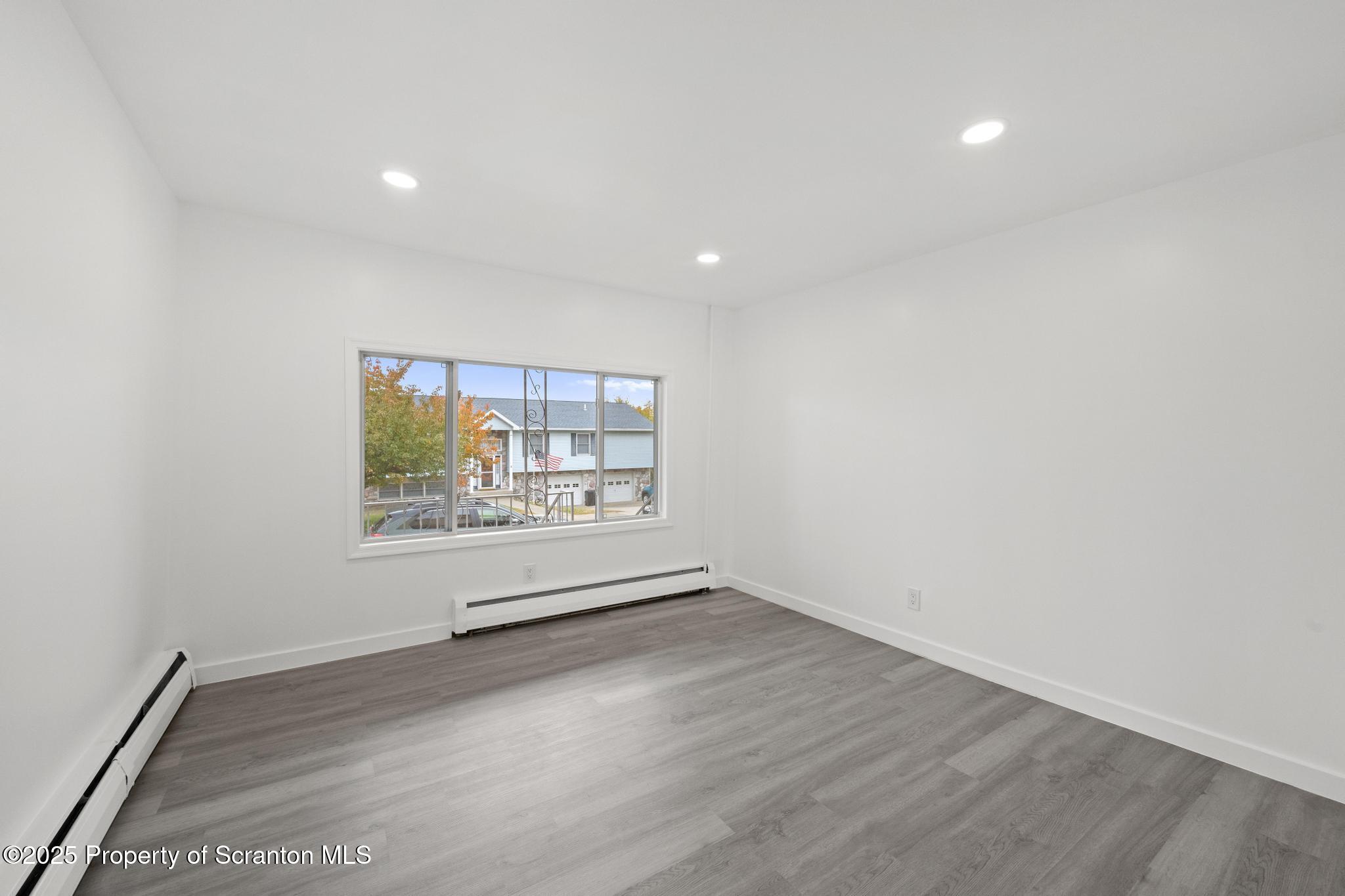 527 St Frances Cabrini Avenue, Unit 2 Scranton, PA 18504 - Photo 21 of 36 a view of an empty room with a window