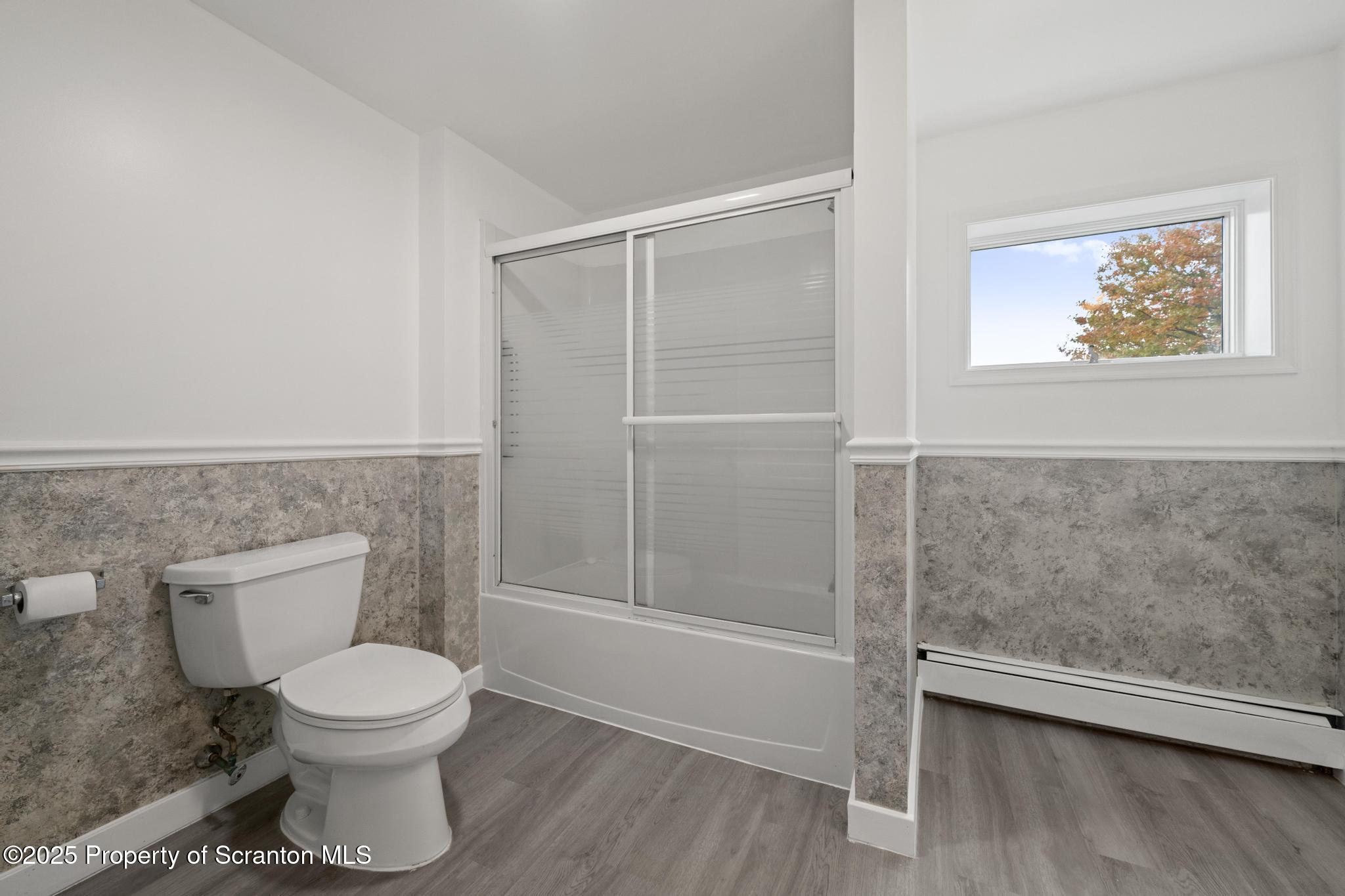 527 St Frances Cabrini Avenue, Unit 2 Scranton, PA 18504 - Photo 23 of 36 a bathroom with a toilet and a shower
