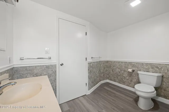 a bathroom with a toilet and a sink