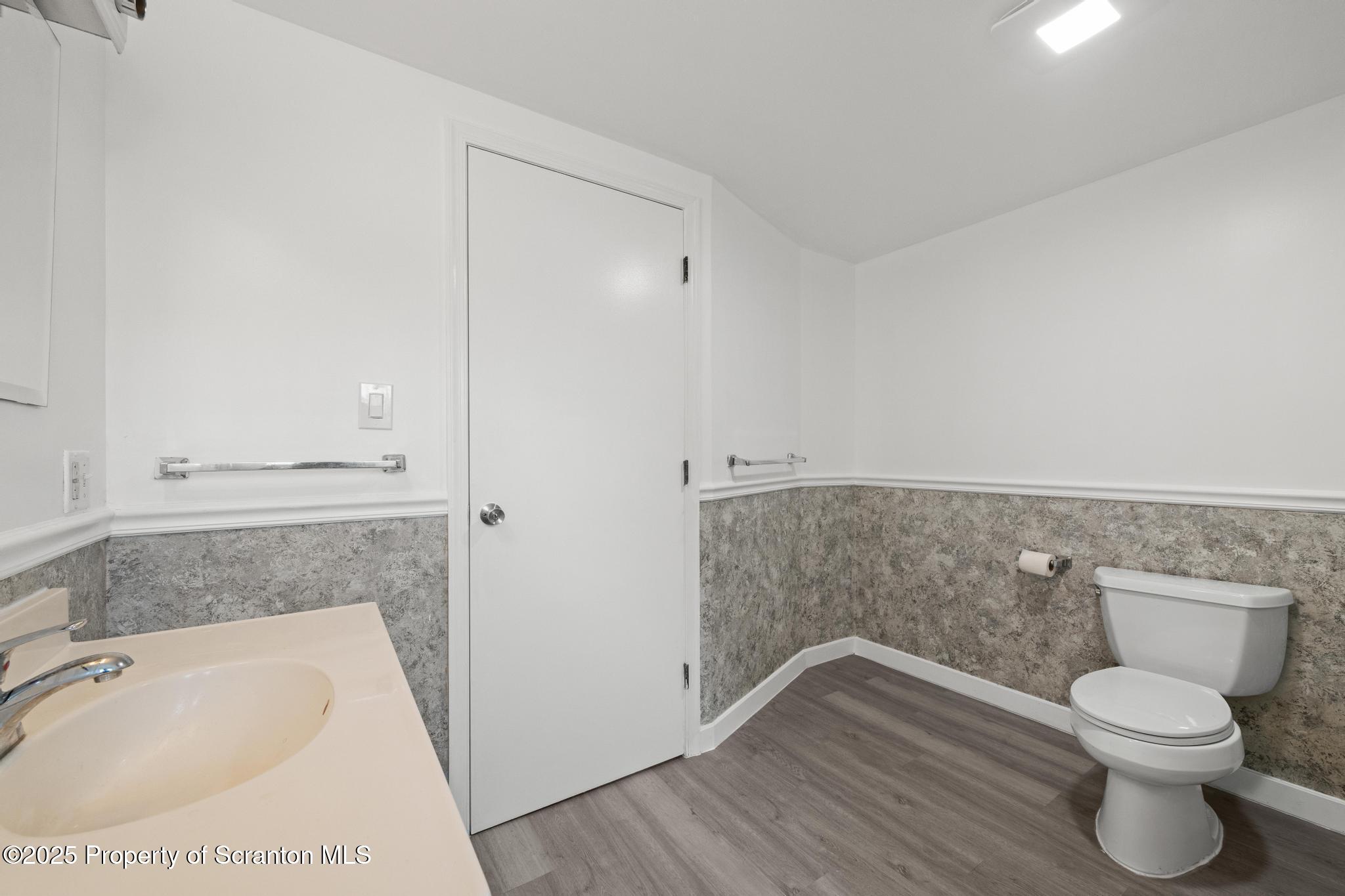 527 St Frances Cabrini Avenue, Unit 2 Scranton, PA 18504 - Photo 25 of 36 a bathroom with a toilet and a sink