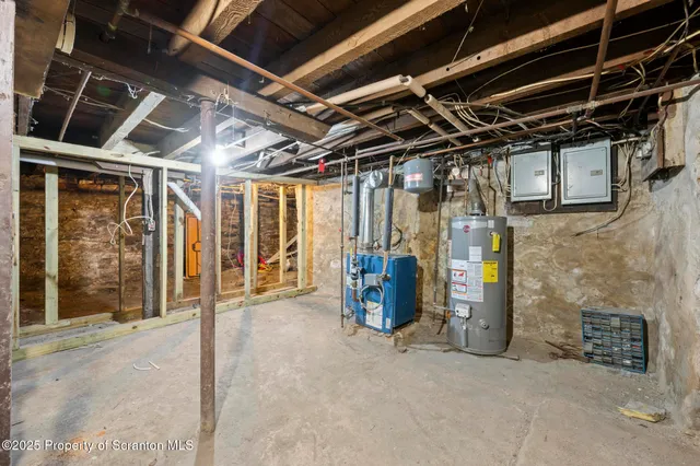 a view of an empty room with wooden walls