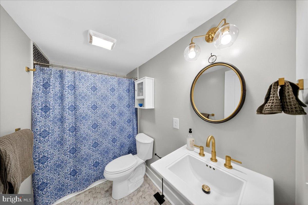 2505 West Denneys Road Dover, DE 19904 - Photo 29 of 68 Chic bathroom with modern fixtures and decor.