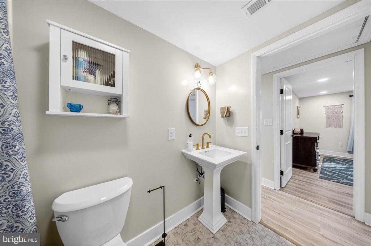 2505 West Denneys Road Dover, DE 19904 - Photo 30 of 68 Chic bathroom with modern fixtures and charm.