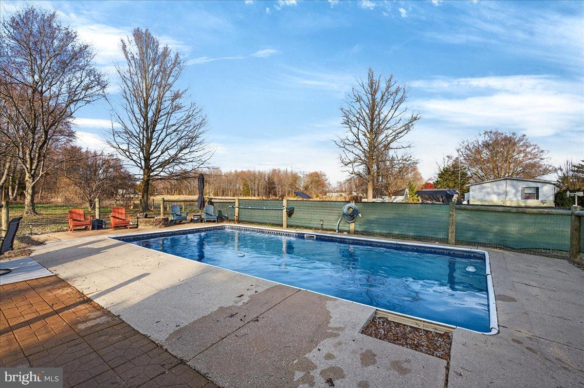 2505 West Denneys Road Dover, DE 19904 - Photo 56 of 68 Tranquil backyard oasis with inviting pool.