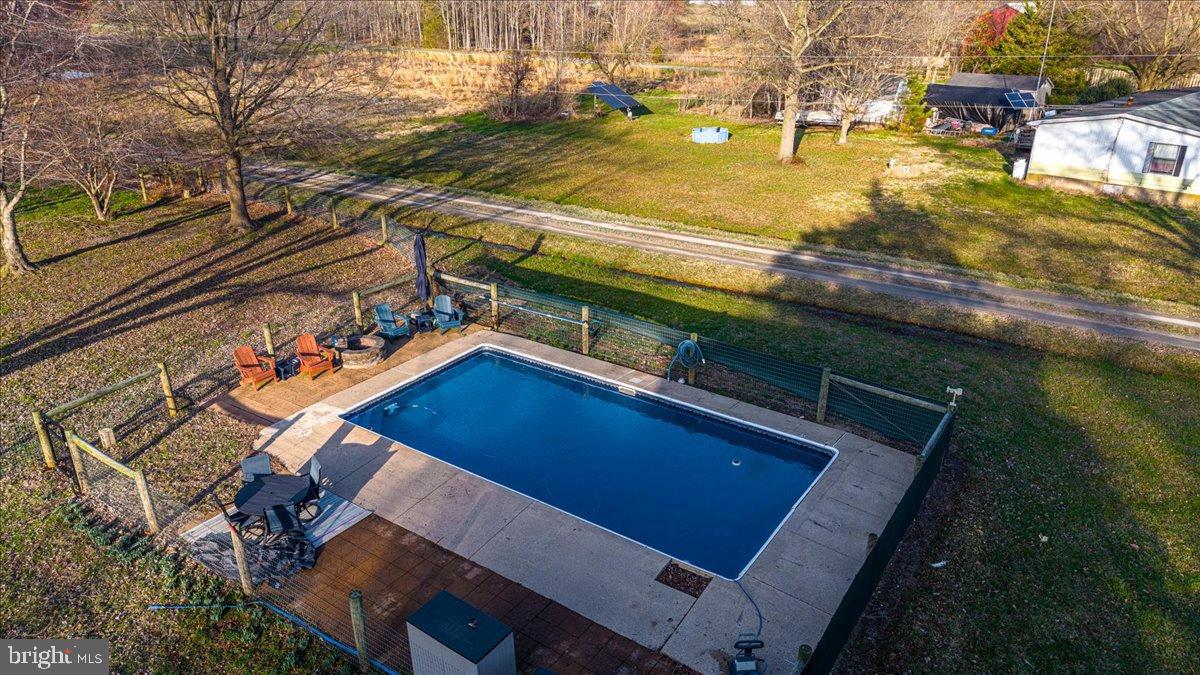 2505 West Denneys Road Dover, DE 19904 - Photo 57 of 68 Serene backyard oasis with inviting pool.