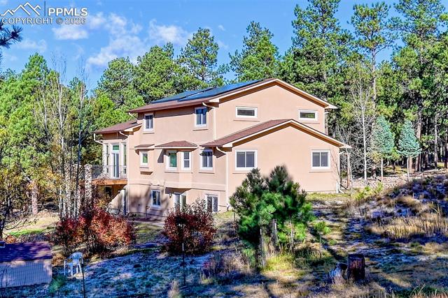 16111 Roller Coaster Road Colorado Springs, CO 80921 - Photo 1 of 26 Custom home with stucco siding and solar PV panels