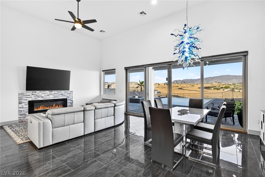 1460 Blue Ridge Trail Mesquite, NV 89027 - Photo 4 of 39 Glass sliders offer seamless indoor-outdoor living, framing distant hills.