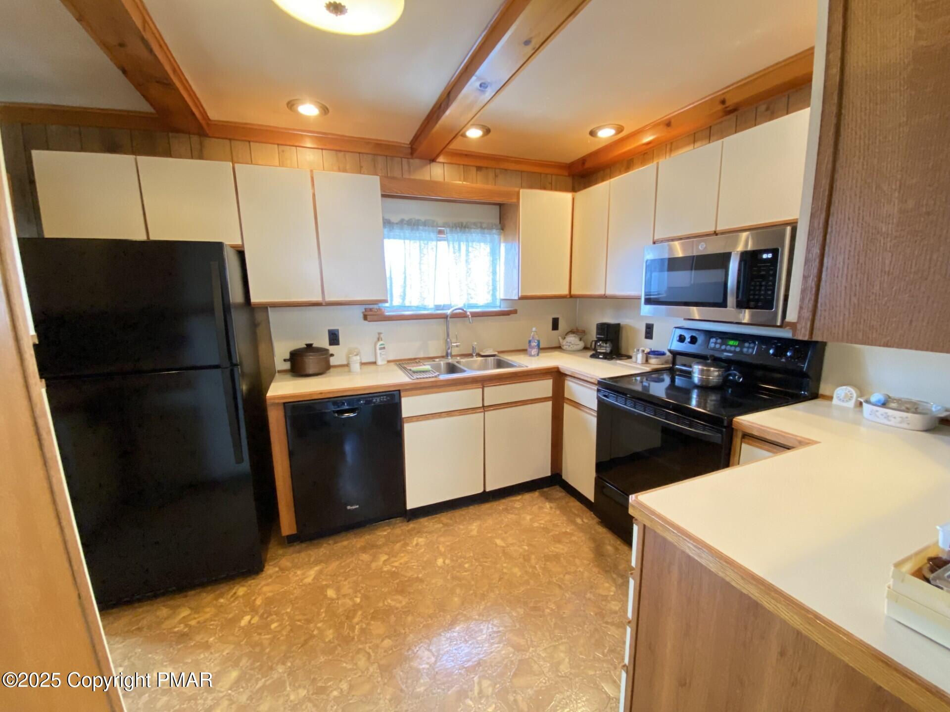 1 West Ridge Street Coaldale, PA 18218 - Photo 30 of 78 a kitchen with a sink a stove a refrigerator and a sink