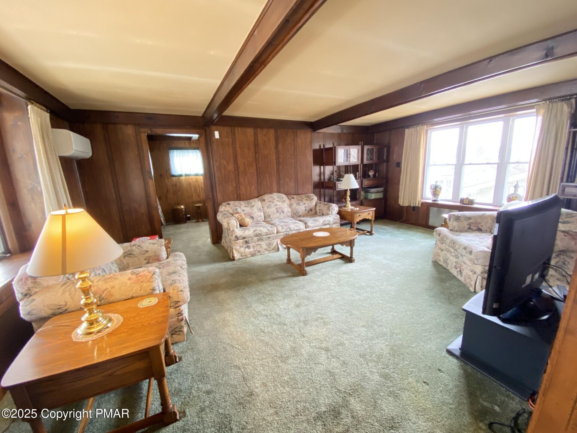 1 West Ridge Street Coaldale, PA 18218 - Photo 37 of 78 a living room with furniture and a flat screen tv