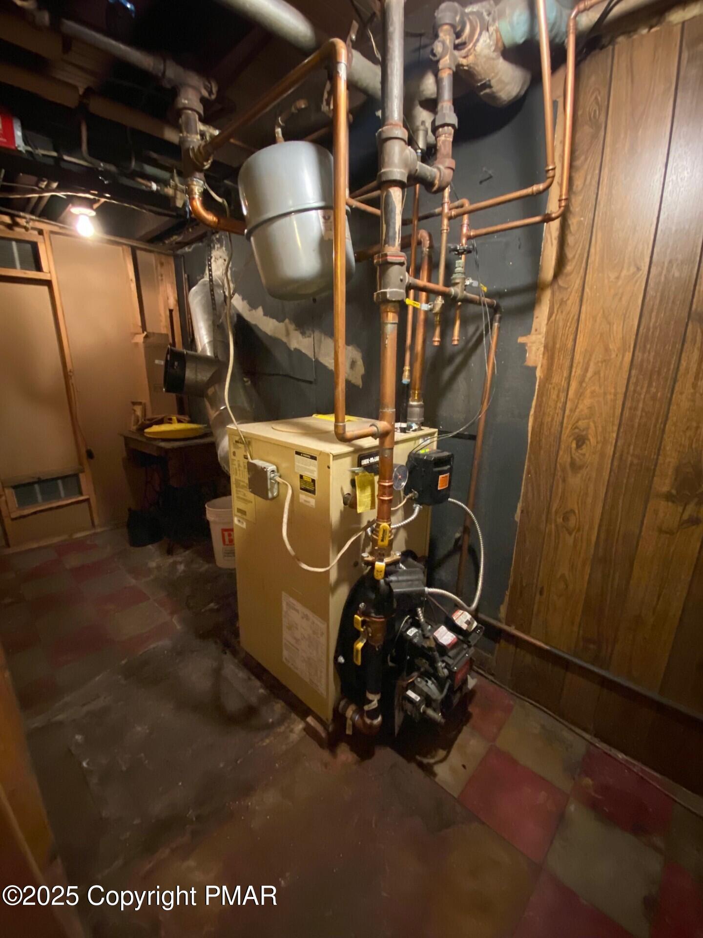 1 West Ridge Street Coaldale, PA 18218 - Photo 72 of 78 a view of a room with water heater and wooden cabinets