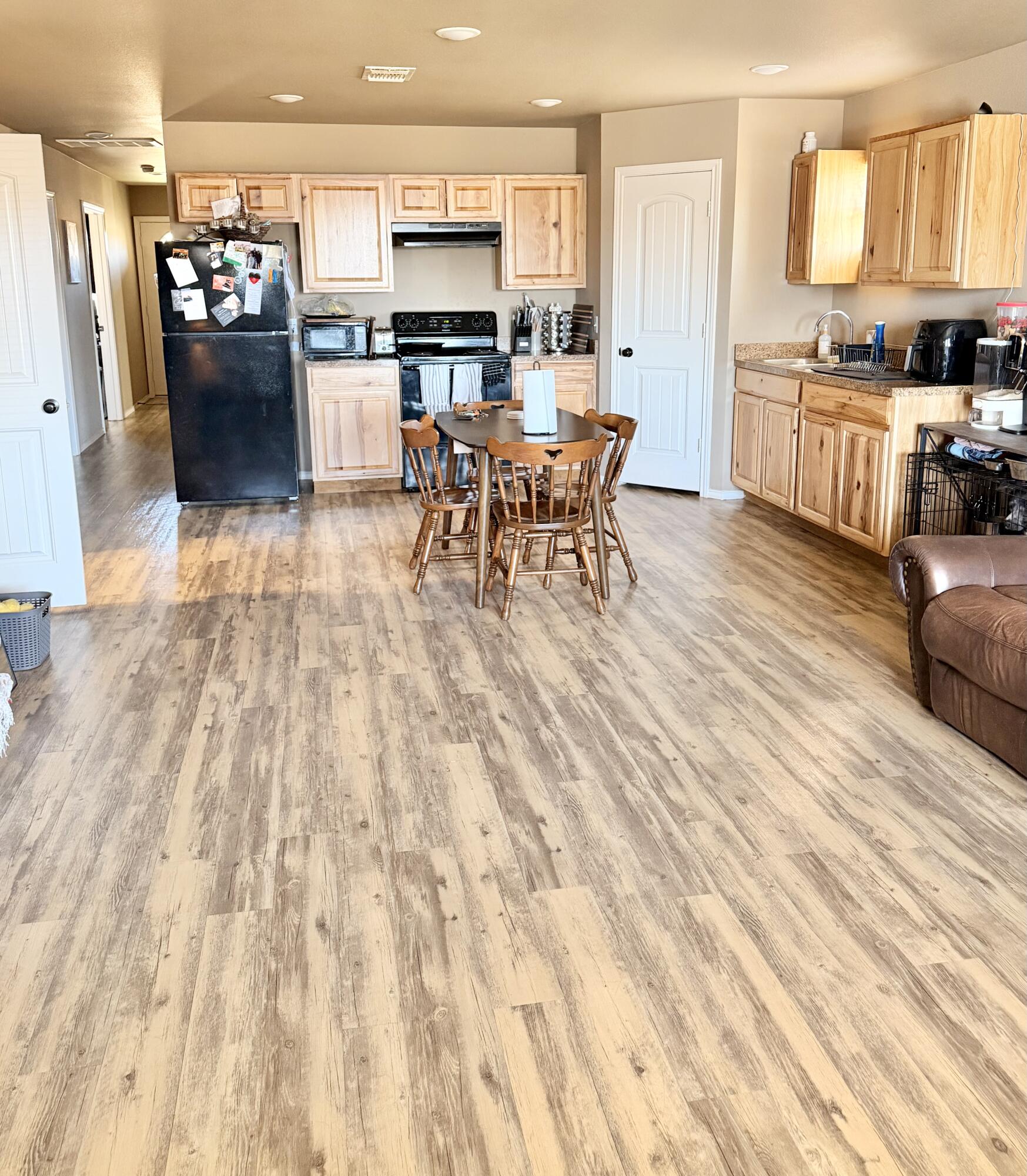 3211 East 5th Street Lubbock, TX 79403 - Photo 3 of 11 a living room with stainless steel appliances furniture and a kitchen view