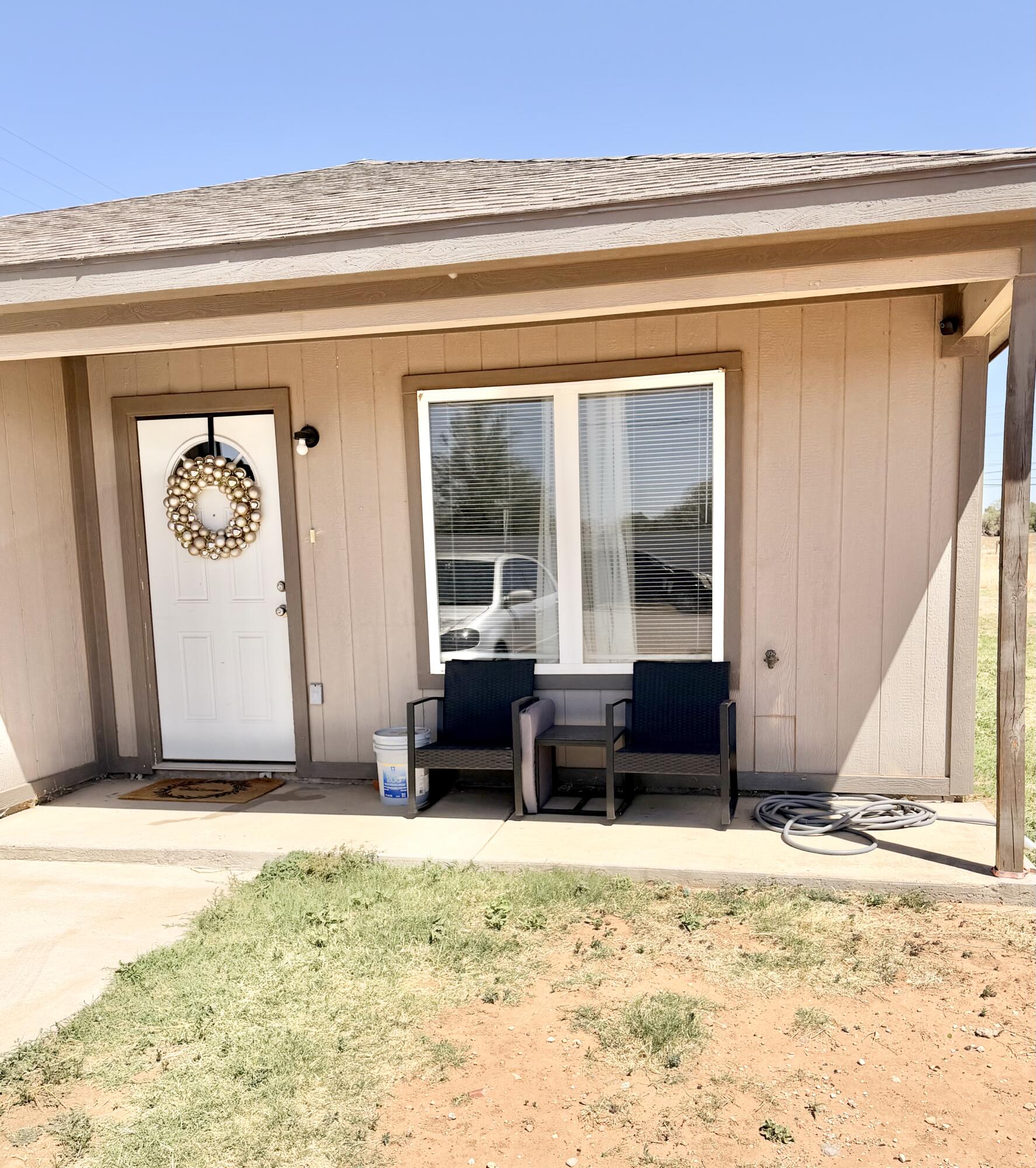 3211 East 5th Street Lubbock, TX 79403 - Photo 9 of 11 a view of a entryway door of the house