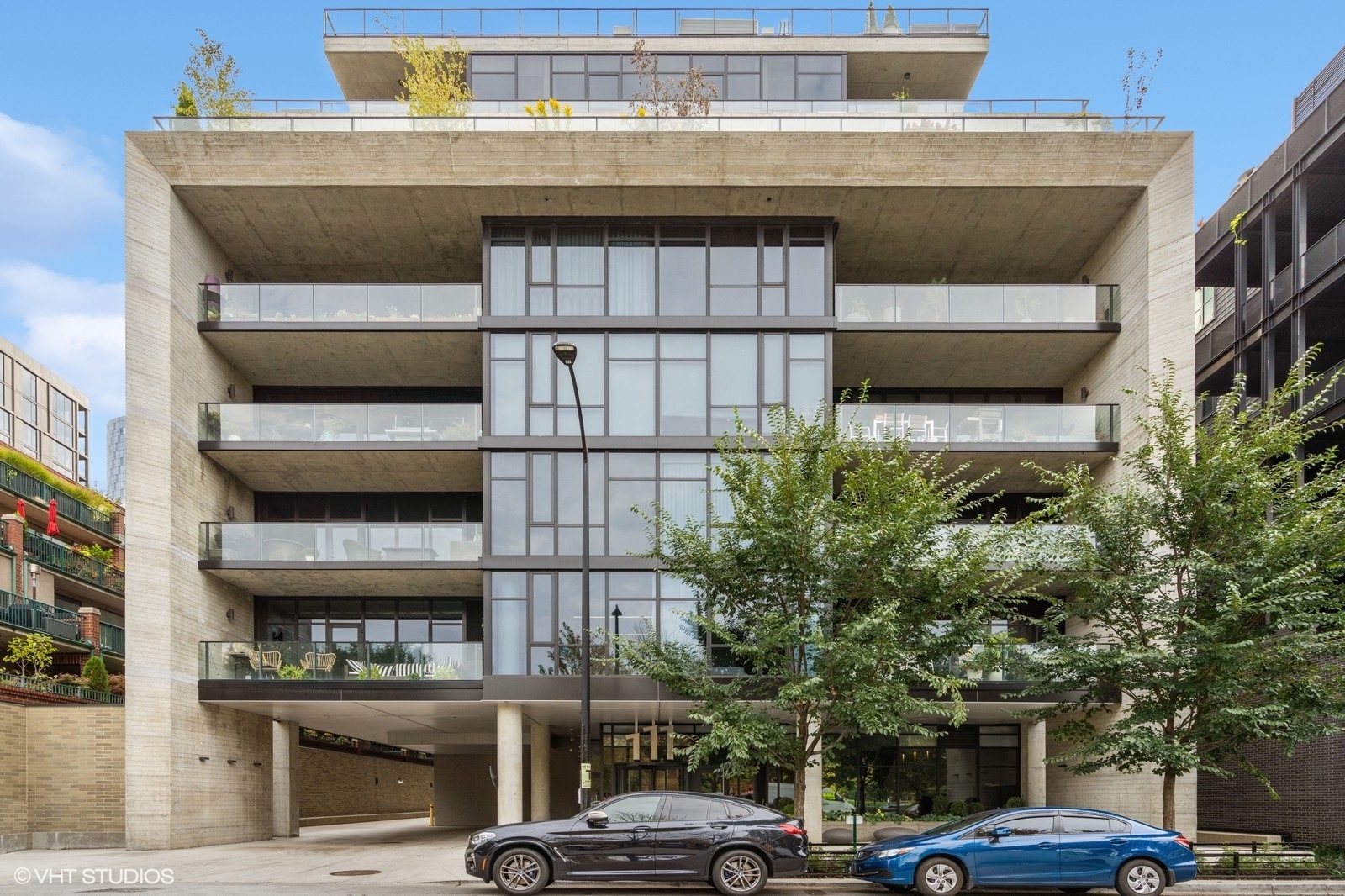 a front view of a building with parking space