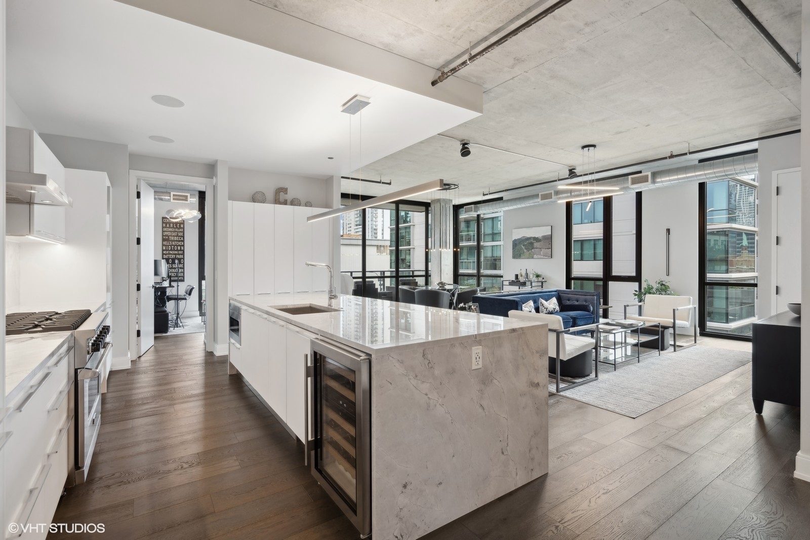 111 South Peoria Street, Unit 404 Chicago, IL 60607 - Photo 14 of 37 a large kitchen with stainless steel appliances lots of counter space and windows