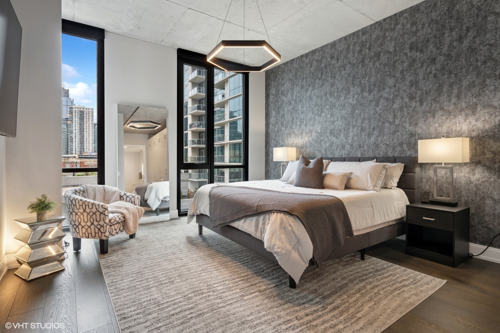 111 South Peoria Street, Unit 404 Chicago, IL 60607 - Photo 18 of 37 a bedroom with a bed and wooden floor